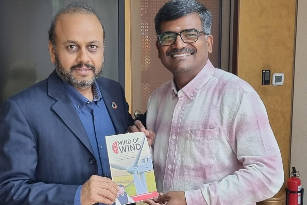 Dr Karunamoorthy has presented the book  “mind of wind” to the Mr Karl Mehta CEO of FushionX