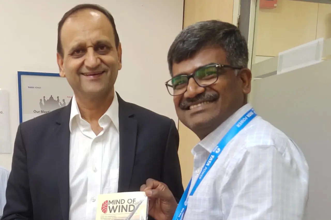 Dr Karunamoorthy has presented the book "mind of wind" to the Ashish Khanna CEO of Tata Power Solar